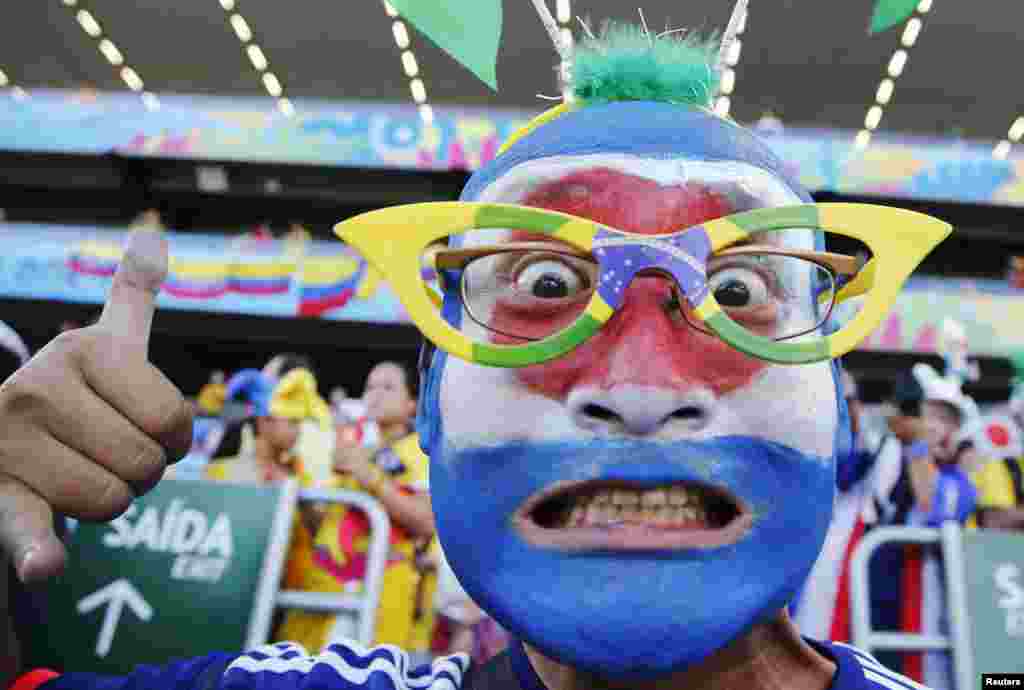 A fan of Japan shows his support before the start of their match against Colombia at the Pantanal arena in Cuiaba, June 24, 2014.