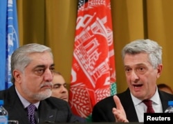 Afghanistan's Chief Executive (L) Abdullah Abdullah and United Nations High Commissioner for Refugees Filippo Grandi attend a two-day conference on Afghanistan at the United Nations in Geneva, Nov. 27, 2018.