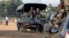 Soldiers patrol the area after an attack in Dabou, around 50 km (30 miles) west of Abidjan, Ivory Coast, Aug. 16, 2012. 