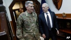 U.S. Defense Secretary James Mattis, right, and U.S. Army General John Nicholson, left, commander of U.S. Forces Afghanistan, arrive to meet with an Afghan defense delegation in Kabul Afghanistan, April 24, 2017. 