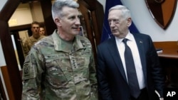 U.S. Defense Secretary James Mattis, right, and U.S. Army General John Nicholson, left, commander of U.S. Forces Afghanistan, arrive to meet with an Afghan defense delegation at Resolute Support headquarters, in Kabul Afghanistan, April 24, 2017. Mattis a