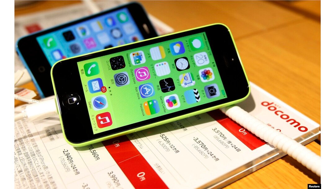 FILE - These then-new Apple iPhone 5c models were on display in at Tokyo store, Sept. 20, 2013. A 5c is at the center of Apple's battle with the FBI over efforts to break the company's proprietary auto-destruct security system.