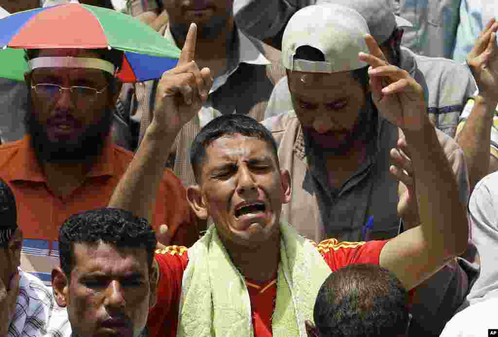 A supporter of Egypt&#39;s ousted President Mohammed Morsi offers his Friday prayer where protesters have installed their camp and held their daily rally, at Nasr city, Cairo, Egypt, July 19, 2013.&nbsp;