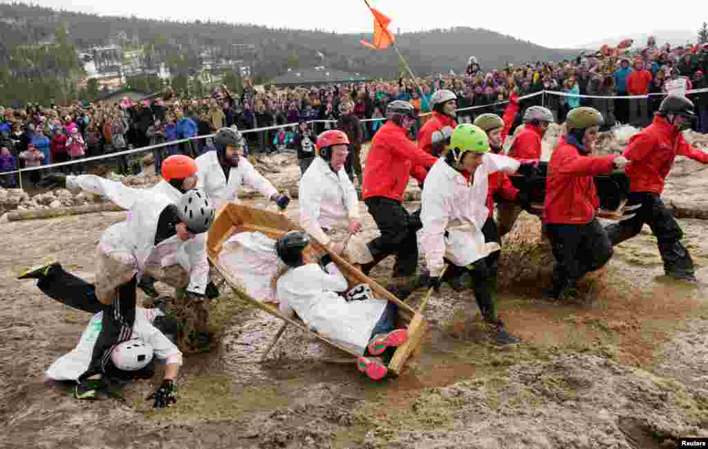 The Nerds team (L) drops their coffin allowing the Eldora Mountain team to take the lead in the coffin races at the yearly &quot;Frozen Dead Guy Days&quot; festival inspired by a frozen corpse in Nederland, Colorado, USA, March 11, 2017.