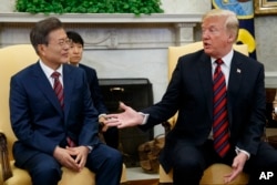 FILE - President Donald Trump meets with South Korean President Moon Jae-In in the Oval Office of the White House, May 22, 2018, in Washington.