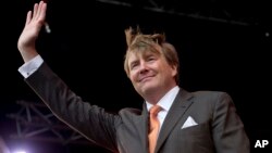 FILE - Dutch King Willem-Alexander celebrates his 50th anniversary on Kingsday during a tour of Tilburg, Netherlands, April 27, 2017. Willem-Alexander regularly co-piloted KLM passenger planes for 21 years.