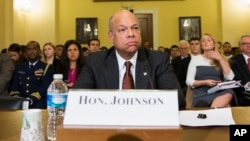 FILE - Homeland Security Secretary Jeh Johnson arrives on Capitol Hill in Washington to testify before a House Homeland Security Committee hearing on the impact of President Barack Obama's executive action on immigration, Dec. 2, 2014.