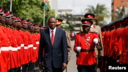 Kenya's President Uhuru Kenyatta inspects the honor guard before the opening of the 11th Parliament at the National Assembly Chamber in the capital Nairobi, Apr. 16, 2013.