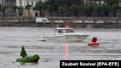 HUNGARY - A police boat takes part in the seach operation for survivors on the River Danube in Budapest, Hungary, 30 May 2019, following a collision of the hotelship and a smaller cruise ship on the previous evening