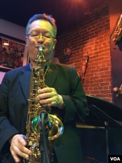 Krit “William” Buranavitayawut plays the saxophone at Alice's Jazz and Cultural Society in Washington, D.C., April 27, 2019.