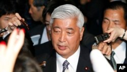 FILE - Japanese Defense Minister Gen Nakatani answers reporters' questions at the prime minister's official residence in Tokyo.