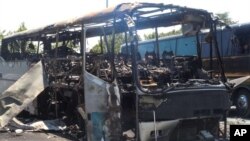 The scene following a deadly suicide attack on a bus full of Israeli vacationers at the Burgas, Bulgaria airport parking lot. After investigation, the Bulgarian government announced Hezbollah was responsible. (file)