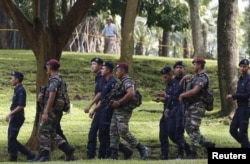 Members of the military and police patrol outside the venue for the 27th Association of Southeast Asian Nations (ASEAN) summit in Kuala Lumpur, Malaysia, Nov. 20, 2015.