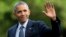 FILE - President Barack Obama waves as he walks across the South Lawn of the White House, in Washington, as he returns from Charlotte, N.C. where he participated in a campaign event with Democratic presidential candidate Hillary Clinton,  July 5, 2016.