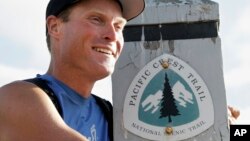 Hiker Scott Williamson talks to friends and supporters celebrates the completion of his second roundtrip hike of the Pacific Crest Trail, Nov. 28, 2006, in Campo, Calif.