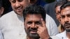 Sri Lankan President Anura Kumara Dissanayake shows his finger as he leaves after casting his vote during the parliamentary election in Colombo, Sri Lanka, Nov. 14, 2024.