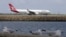 FILE - A Qantas plane prepares to take off at Sydney Airport, at Sydney, Australia.