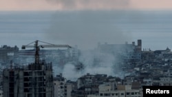 Smoke rises over Dahiyeh in Beirut's southern suburbs after Israeli airstrikes, amid ongoing hostilities between Hezbollah and Israeli forces, as seen from Sin El Fil, Lebanon, Oct. 10, 2024.