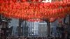 Crowds watch the celebrations for the Chinese Lunar New Year in London&#39;s China town in central London.