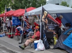 Supporters of U.S. President Donald Trump camp near the BOK Center in Tulsa, Oklahoma, June 19, 2020.