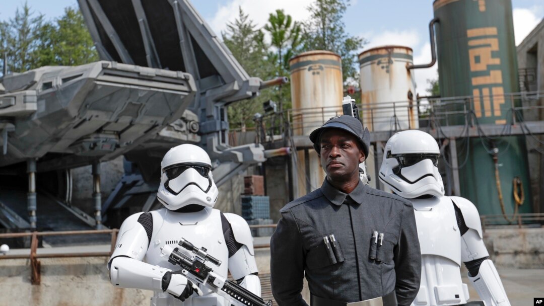 A First Order officer, center, and two storm troopers on patrol during a preview of the Star Wars-themed land, Galaxy's Edge in Hollywood Studios at Disney World, Aug. 27, 2019, in Lake Buena Vista, Florida.