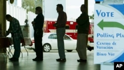 FILE - Voters line up at a polling station to vote in Florida's presidential primary in Coral Gables, Florida. 