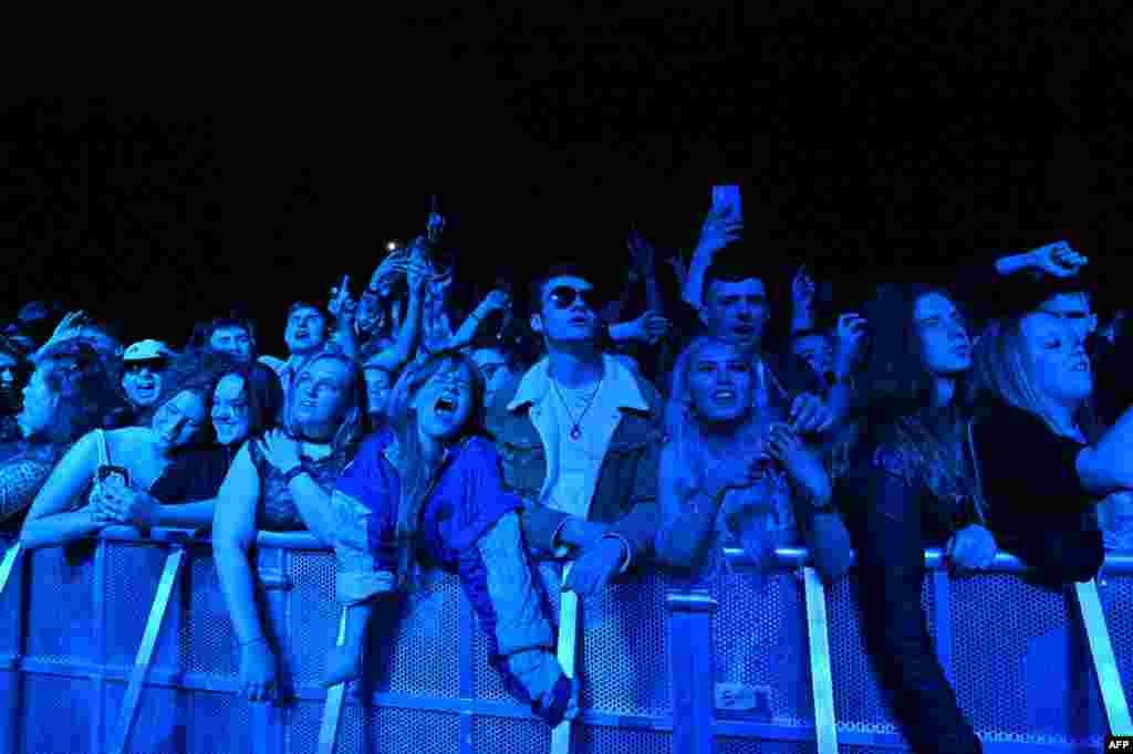 Fans watch Blossom perform at a live music concert hosted by Festival Republic in Sefton Park in Liverpool, north-west England, May 2, 2021, where a non-socially-distanced crowd of 5,000 are expected to attend.