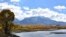 FILE - Emigrant Peak is seen rising above the Paradise Valley and the Yellowstone River near Emigrant, Montana, Oct. 8, 2018. 