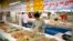 A woman shops for chicken at a supermarket in Beijing, May 12, 2017. China will finally open its borders to U.S. beef while cooked Chinese poultry is closer to hitting the American market as part of a U.S.-China trade agreement. 