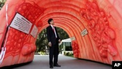 Assemblyman Richard Pan, D-Sacramento, who is pediatrician, passes through an inflatable colon display in Sacramento, Calif., March 24, 2014. The display shows what a healthy colon looks like, how polyps develop and how they can turn cancerous. 