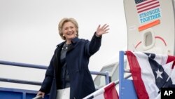 FILE - Democratic presidential candidate Hillary Clinton arrives at Pueblo Memorial Airport in Pueblo, Colo., Oct. 12, 2016, to attend a rally. 