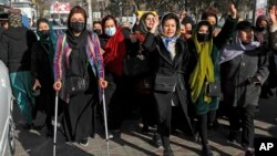 FILE - Afghan women chant slogans during a protest against the ban on university education for women, in Kabul, Afghanistan, Dec. 22, 2022.