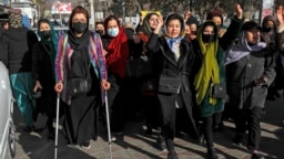 FILE - Afghan women chant slogans during a protest against the ban on university education for women, in Kabul, Afghanistan, Dec. 22, 2022.