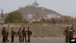 FILE - Members of a French military flight crew talk on the tarmac at France's military air base in Dakar, Senegal, on June 2, 2009. Senegal announced on Dec. 27, 2024, the closure of all foreign military bases.