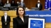 Belarus' opposition leader Sviatlana Tsikhanouskaya poses with the Sakharov Prize, European Union's annual human rights award, during a ceremony at the EU Parliament in Brussels, Belgium, Dec. 16, 2020. (John Thys/Pool via Reuters)