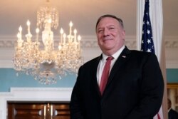 FILE - Secretary of State Mike Pompeo waits for a meeting at the U.S. State Department in Washington, Sept. 4, 2020.