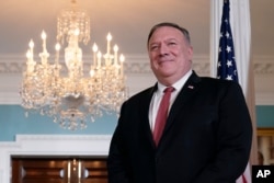 FILE - Secretary of State Mike Pompeo waits for a meeting at the U.S. State Department in Washington, Sept. 4, 2020.