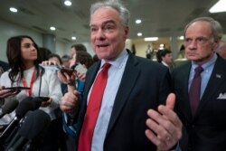 FILE - Democratic Senator Tim Kaine speaks to reporters following a briefing on the details of the threat that prompted the U.S. to kill Iranian Gen. Qassem Soleimani in Iraq, , on Capitol Hill in Washington, Jan. 8, 2020.