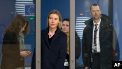 European Union foreign policy chief Federica Mogherini, center, arrives for a meeting of EU foreign ministers at the EU Council building in Brussels, Belgium, Feb. 6, 2017.