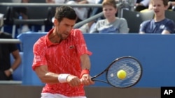 Serbia's Novak Djokovic returns the ball during an exhibition tournament in Zadar, Croatia, June 21, 2020.