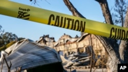 Yellow tape from the Kincade Fire surrounds the old general store and post office built in 1869, that had become the main building for the Soda Rock Winery in Healdsburg, California,Nov. 5, 2019.