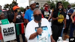 FILE - Catherine Davis, mother of Marc Davis, who was shot and killed by a Petal, Mississippi, police officer in 2017, speaks during a protest in Jackson, Mississippi, June 5, 2020. 