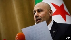 Yasser Farhan, spokesperson for the Syrian fact-finding committee tasked with investigating violence and revenge killing targeting the Alawite minority sect along the Syrian coast, holds a press conference in Damascus on March 11, 2025.