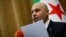 Yasser Farhan, spokesperson for the Syrian fact-finding committee tasked with investigating violence and revenge killing targeting the Alawite minority sect along the Syrian coast, holds a press conference in Damascus on March 11, 2025.