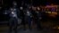 Tunisian police officers stand guard after an attack on a military bus Nov. 24, 2015, in Tunis, Tunisia. 
