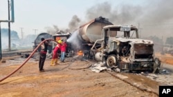 Firefighters extinguish fire from a tanker that exploded in Suleja, Nigeria, Jan. 18, 2025.