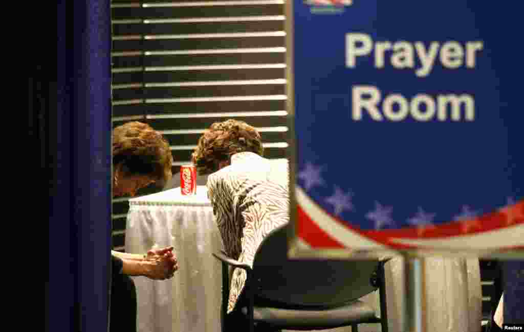 Convention goers pause in the prayer room.