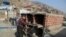 Retired merchant Victor Coba takes measurements of the tombs he's building for his family at San Lazaro cemetery on the outskirts of Lima, Peru, May 12, 2021. 