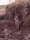 Soldiers from the Spanish Parachute Squadron (EZAPAC) look for bodies after floods in Barranco del Poyo, Spain, Nov. 5, 2024. 
