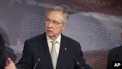 Senate Majority Leader Harry Reid gestures during a news conference on Capitol Hill in Washington, July 29, 2011